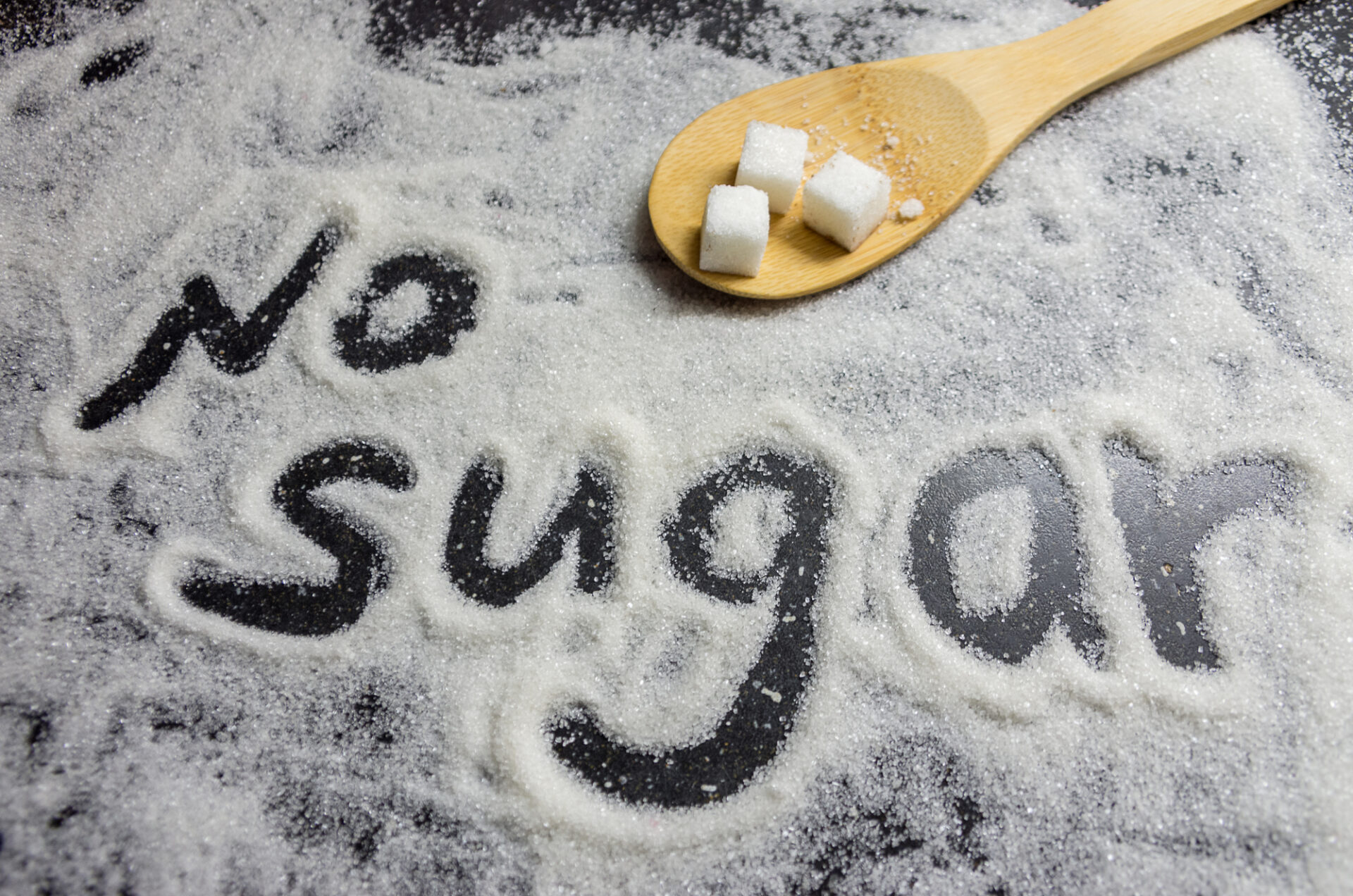 Picture of the words No Sugar written in sugar.